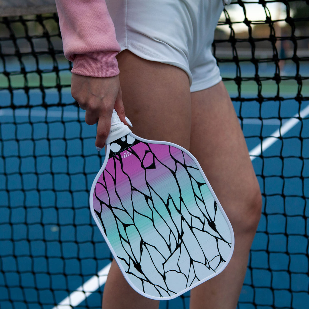 Imagine a store shelf full of aesthetically designed pickleball paddles. They come in a wide array of colors: rich blues, vibrant reds, deep purples, and sunny yellows. Some are sleek and minimalist i