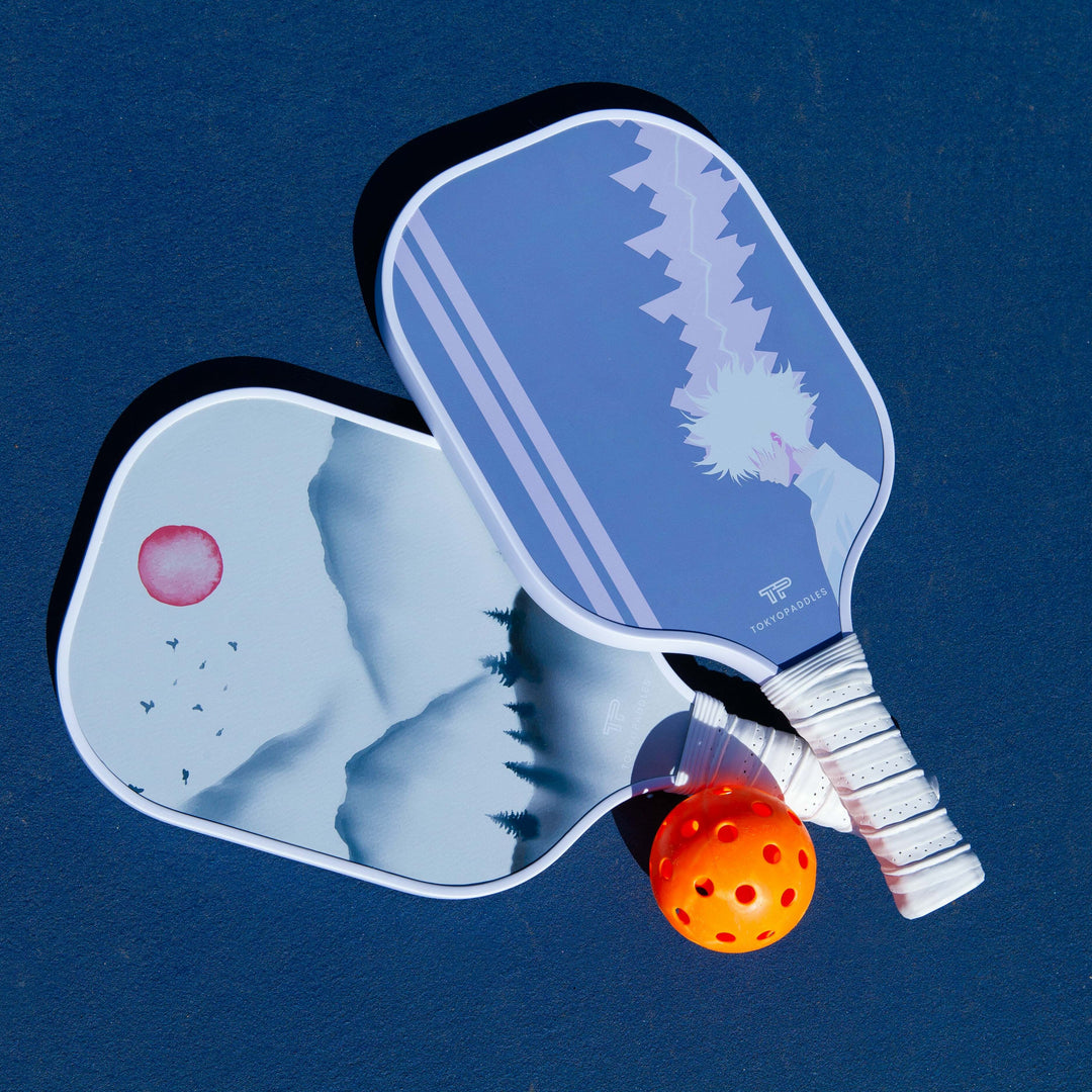 An image depicting a mixed array of second-hand pickleball equipment, exhibiting varying degrees of usage. At the forefront, a white woman is analyzing a pickleball paddle's quality while a black man 